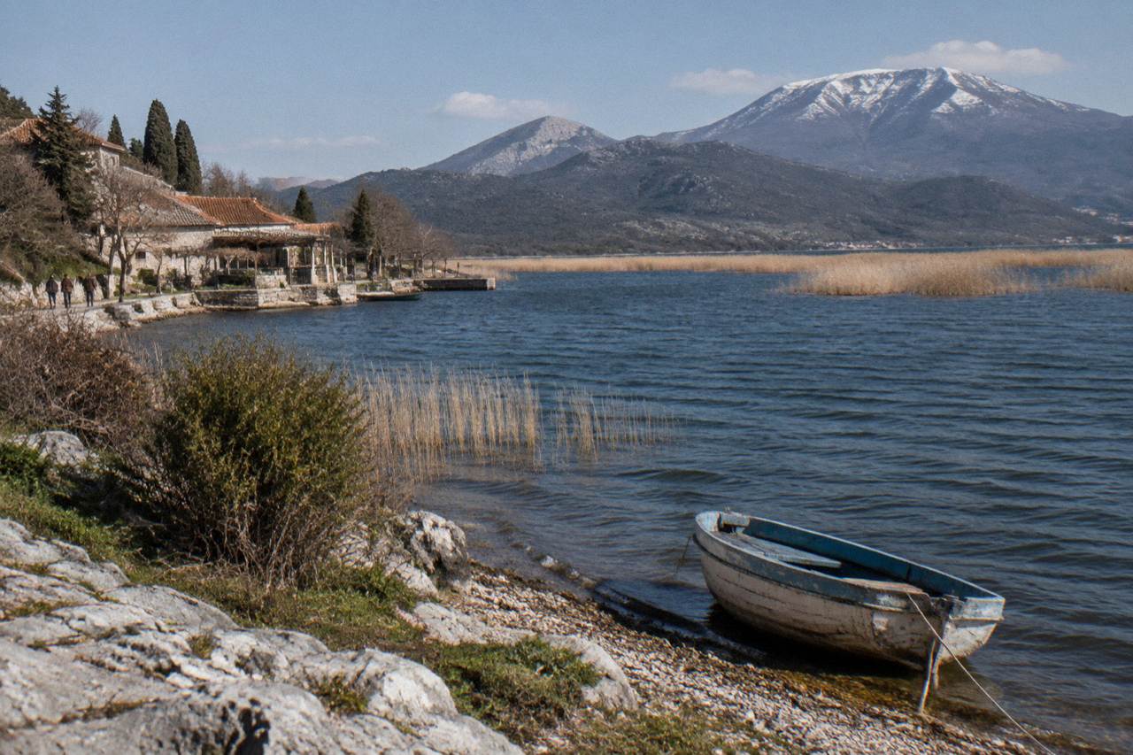 Wide view across Lake Skadar with reed beds and distant hills