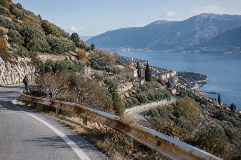 Coastal road winding along steep hillsides above the Adriatic south of Dubrovnik