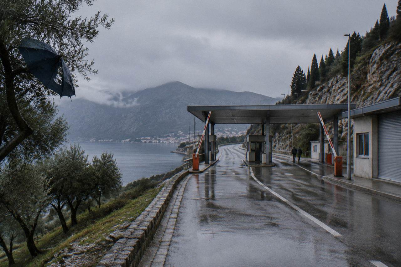 Quiet border checkpoint buildings on a coastal road between Croatia and Montenegro
