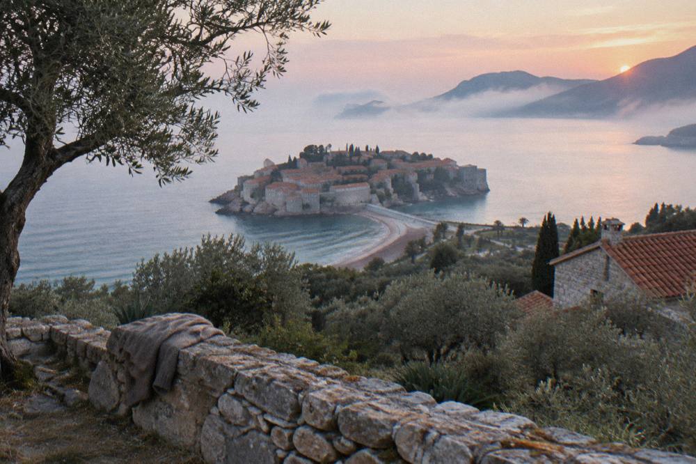 Fortified island connected by a narrow causeway to a coastal hillside